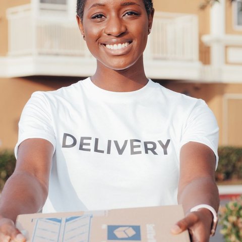 Person in a white DELIVERY t-shirt